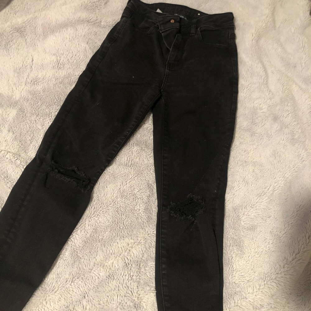 Ripped knee black jeans
